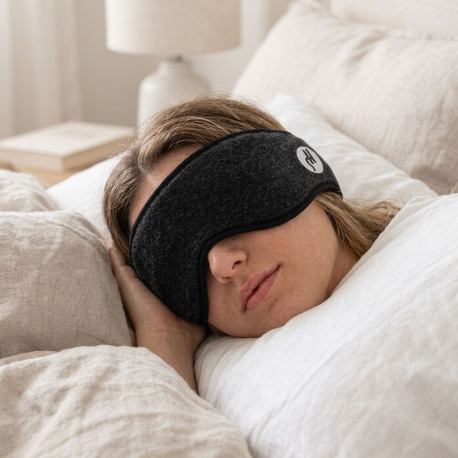 Woman sleeping peacefully wearing Zentivo contoured sleep mask